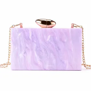 Starry pink acrylic evening clutch bag with marble texture and gold chain strap