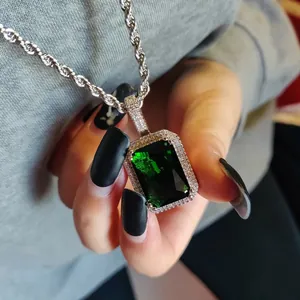 Luxury hip-hop necklace featuring a large emerald-green square pendant on a silver rope chain