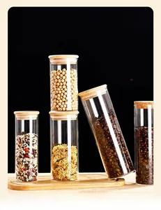Set of clear borosilicate glass storage jars with bamboo and cork lids for kitchen grains