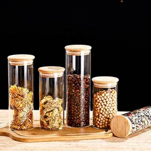 Set of clear glass storage jars with bamboo lids for coffee beans and grains