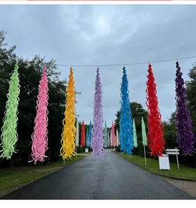 Colorful spiral tassel streamers hanging outdoors for festive party and wedding decoration