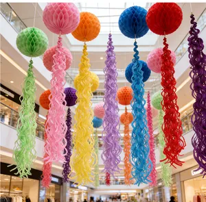 Macro detail of colorful honeycomb paper ball ornaments with spiral fringe for festive events