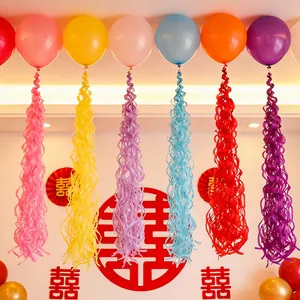 Colorful festive balloons with spiral hanging tassels for wedding and party decorations