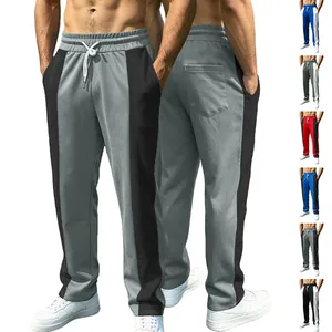 Detail view of men's color-block joggers with elastic drawstring waist and side pockets