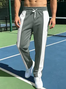 Close-up of contrast side panels and drawstring waist on men's athletic joggers