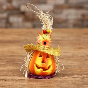 Halloween foam pumpkin decoration with wizard hat, sunflower and hanging rope on wood
