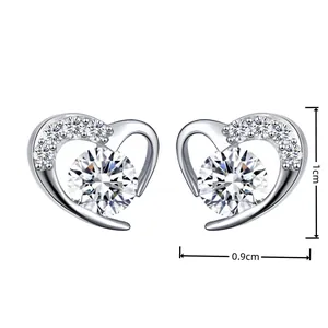 Detail view of heart-shaped diamond earrings showing dimensions 1cm by 0.9cm