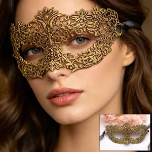 Elegant gold lace masquerade mask with intricate hollow embroidery and black silk ribbons