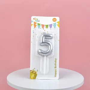 Close-up of a silver number 5 birthday candle in professional retail packaging