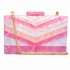 Pink and white V-pattern acrylic evening clutch with gold chain strap for women