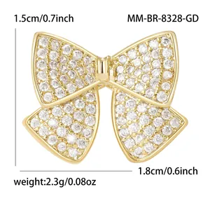 Bowknot brooch with gold-plated copper and cubic zirconia, shown with size measurements