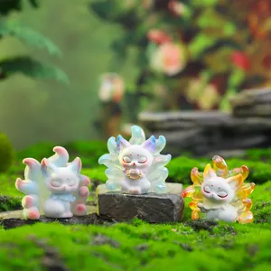 Three Nine-Tailed Fox resin figurines in varied colors on mossy stone background