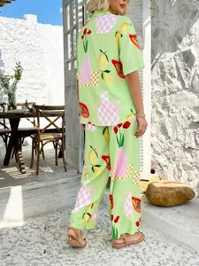 Outdoor back view of a tropical print summer set with lemon and floral patterns