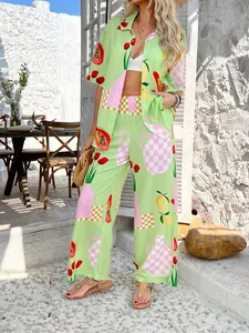 Detail of light green bohemian set featuring vibrant tropical fruit and floral patterns