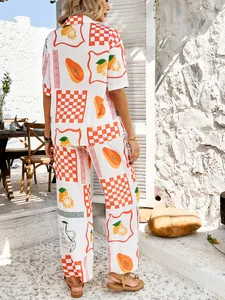 Detail of vibrant tropical fruit and orange checkered print on breathable summer fabric