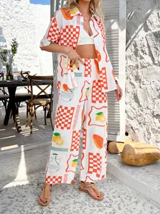 Detail of bohemian two-piece set featuring vibrant papaya and orange checkerboard prints