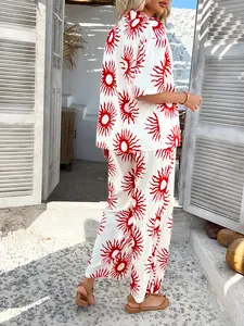 Detail showing red sunburst print on lightweight woven fabric for summer vacation set