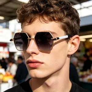 Close-up of geometric hexagonal sunglasses with gold metal frame and gradient lenses