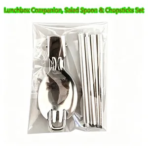 Close-up of portable stainless steel foldable spoon fork and chopsticks in packaging
