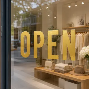 3-inch gold foil letter stickers spelling OPEN on a boutique glass window