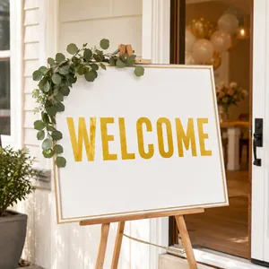 Macro view of 3-inch gold foil alphabet stickers spelling 'WELCOME' for party decor