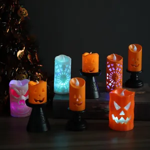 Close-up of Halloween LED lantern set with pumpkin and skull patterns on dark background