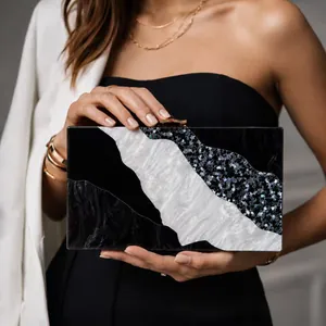Chic color-block acrylic clutch with marble pattern and gold clasp for elegant parties