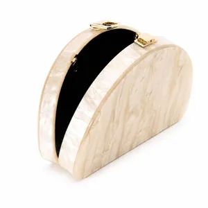 Semicircular acrylic evening clutch bag with marble texture and gold metal clasps
