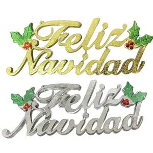 Gold and silver Feliz Navidad Christmas ornaments with glitter finish and holly leaves