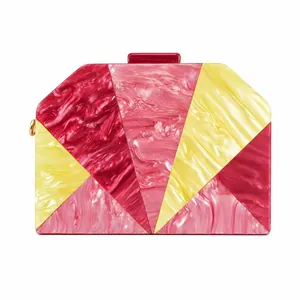 Elegant geometric marble acrylic clutch bag with red and pink patchwork design for weddings
