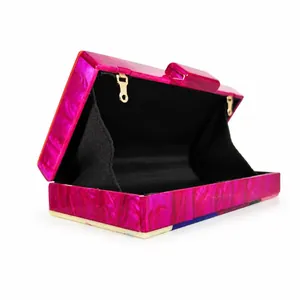Hot pink marble acrylic clutch bag with rectangular hard shell and luxury chain strap