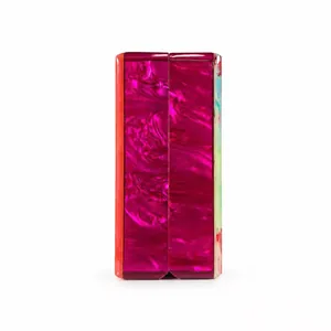 Detail of magenta marble acrylic clutch showing colorful textured side panels