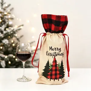 Detail of burlap Christmas wine bottle gift bag with red plaid tree and Merry Christmas text