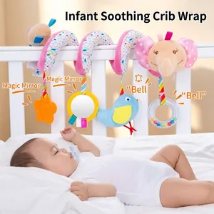 Baby activity spiral toy with hanging rattles and mirror on a white crib