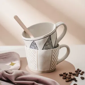 Japanese style hand-painted stoneware coffee mug set with geometric patterns and wooden spoon