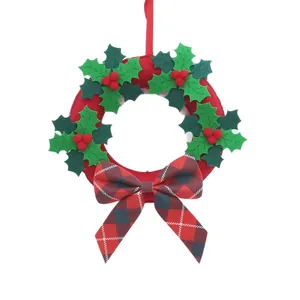 Christmas wreath wall hanging with red green felt leaves and black red plaid bow tie