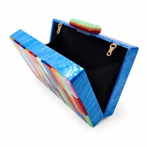 Blue marble acrylic clutch bag with vibrant stripes for evening parties and weddings