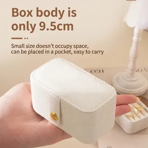 Mini portable jewelry box in beige PU leather with snap button for travel storage