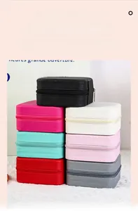 Mini square jewelry boxes with zippers in seven assorted colors and textured finishes