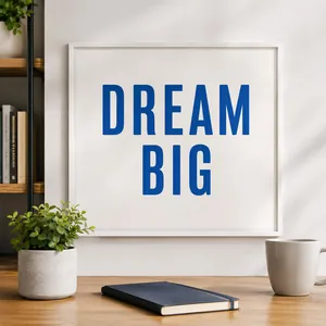 Detail showing 'DREAM BIG' blue typography in a modern white square frame on the wall