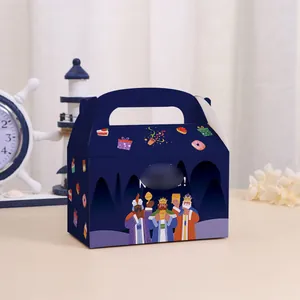 Detail of the dark blue Spanish holiday gift box featuring festive illustrations and handle