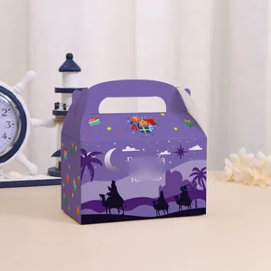 Close-up view of a purple Spanish holiday candy gift box with festive camel design
