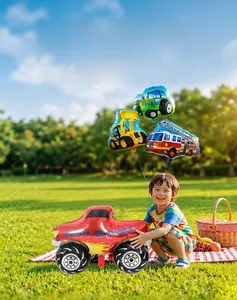 Construction vehicle foil balloons for birthday party decoration on a sunny park lawn