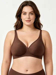 Detail of a deep V seamless bra with wide wings and soft support in dark brown color