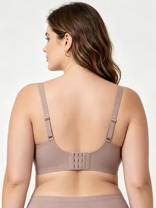 Detail view of seamless wide straps and three-row hook closure on mauve back bra