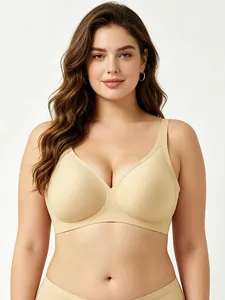 Front view of beige seamless deep V-neck bra with wide straps for comfort and support