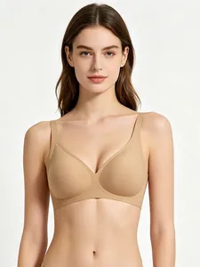 Detail of nude seamless wireless bra with smooth laser-cut edges on a professional model