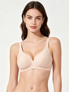 Detail of seamless beige deep V-neck bra with wide straps for smooth comfort and support