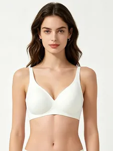 Close-up of seamless white deep V-neck bra with wide straps and smooth elastic fabric