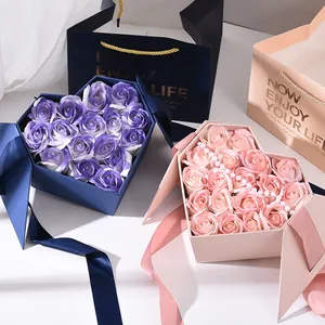 Elegant heart-shaped gift box with soap roses and matching carry bag for wedding favors